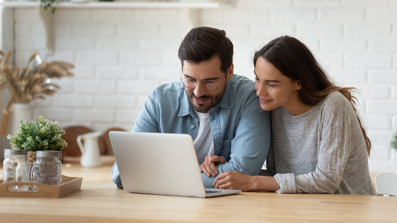 couple looking at laptop computer